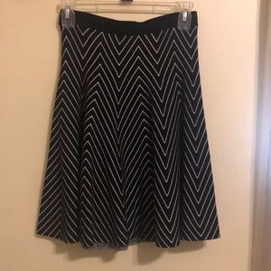 Sweater material, black and white skirt